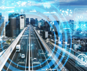 A city highway with vehicles is overlaid by digital graphics representing data, connectivity, and smart city technology.