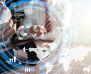 Two people discussing data on a tablet with overlaid digital charts, graphs, and a world map representing global analytics and business metrics.